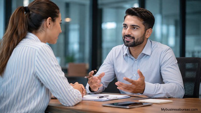 Professional business meeting discussing communication and client management skills