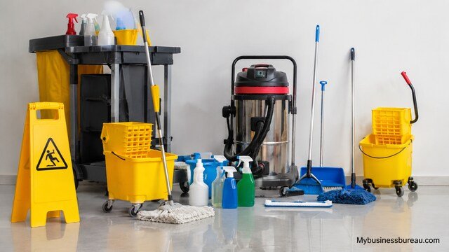 Professional cleaning equipment and janitorial supplies arranged in a commercial cleaning workspace.