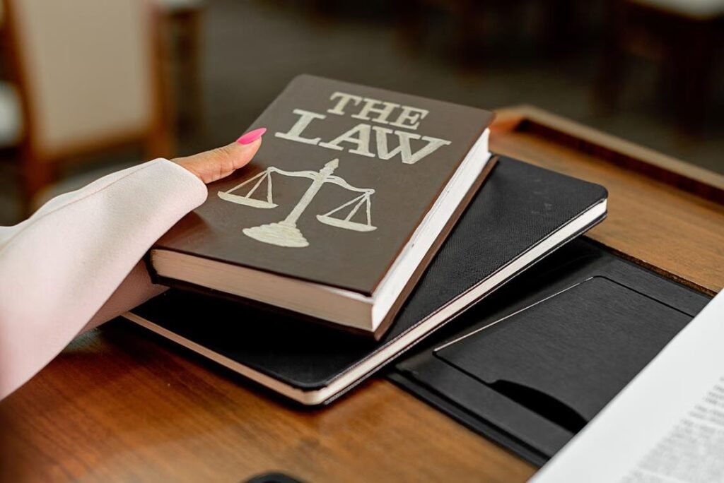 Why Every Nonprofit Needs a Dedicated Legal Advisor From Day One Nonprofit legal advisor represented by a law book and scales of justice.